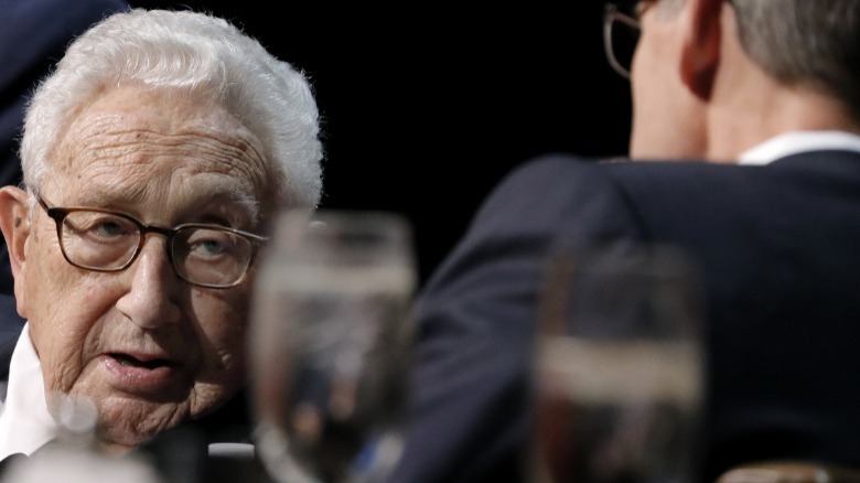 Kissinger looking at someone