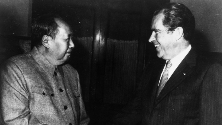 President Nixon and Chairman Mao smiling 