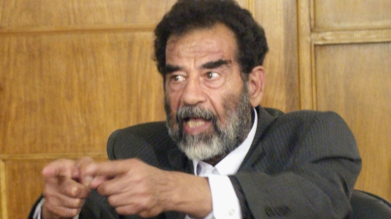 Saddam Hussein pointing