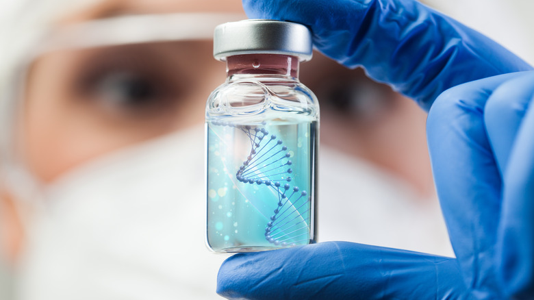 scientist holding a DNA vial