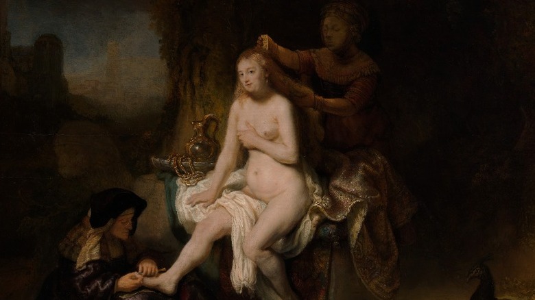 A naked Bathsheba getting her feet and hair manicured 