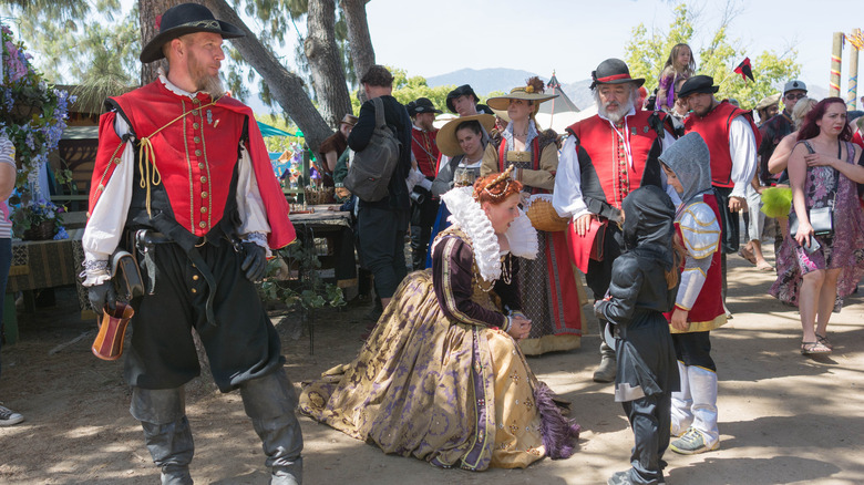 Renaissance fair queen talking child