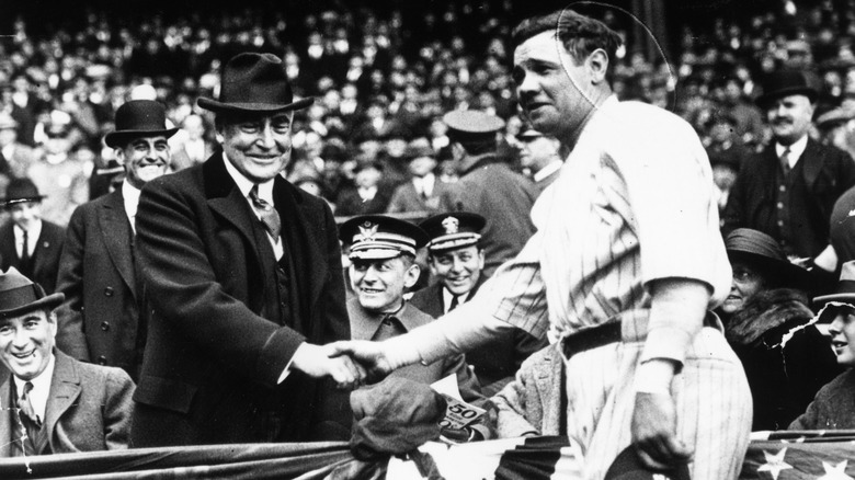 Babe Ruth shaking hands with President Warren G. Harding