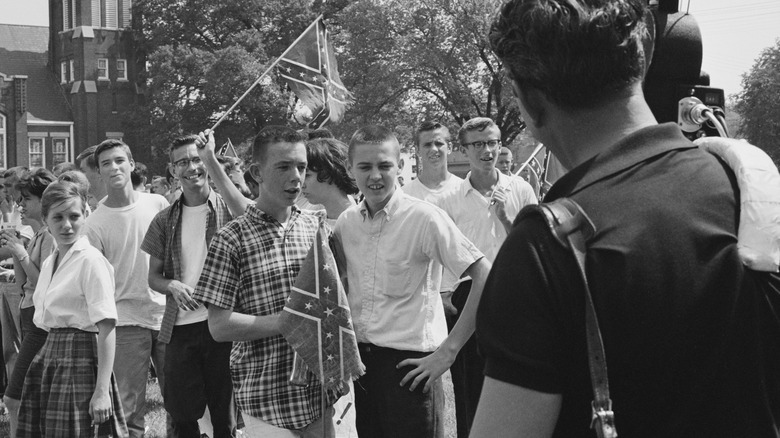 White students with confederate flag