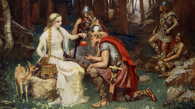 A woman offering an apple to a Viking 