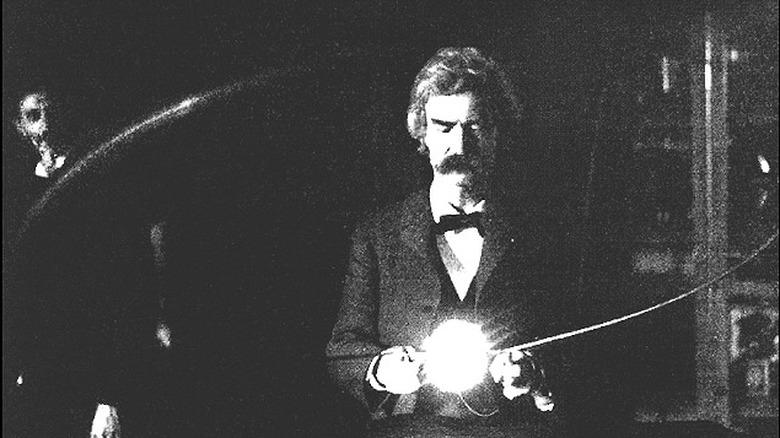 Mark Twain in Tesla's lab with coil bulb, 1894