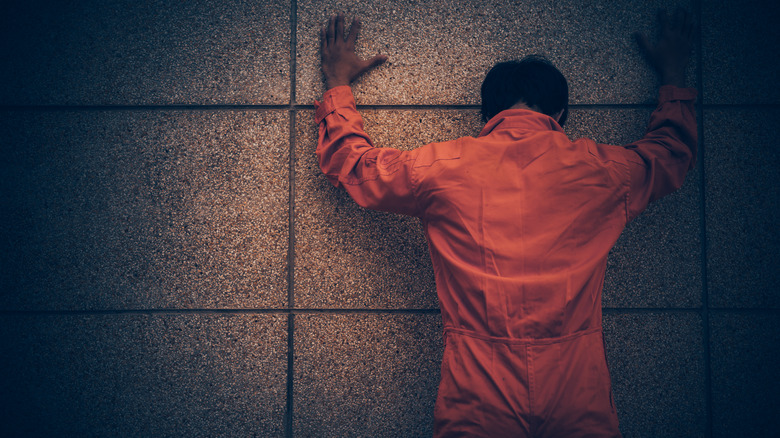 man in prison orange
