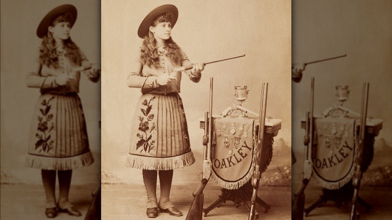 Annie Oakley holding a gun