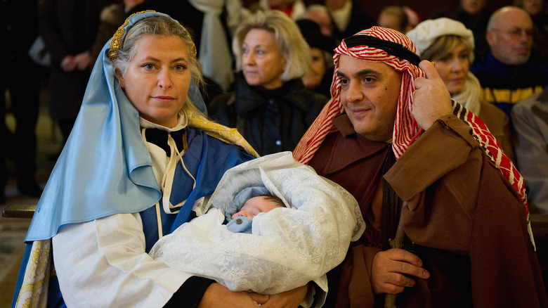 People dressed as Mary and Joseph nativity