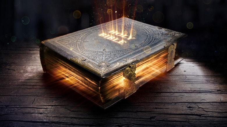a bible with light emerging