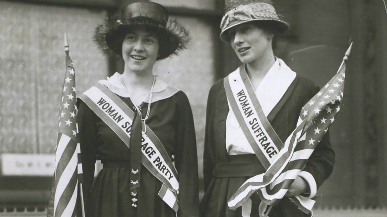 Women wearing Woman Suffrage Party sashes