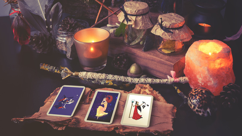 tarot cards with candles and shells