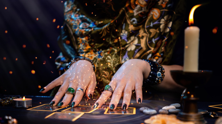 Person reading tarot cards