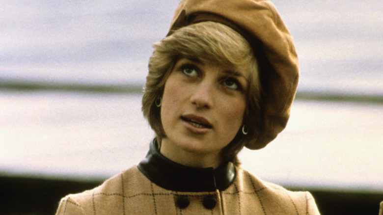 Princess Diana looking up in hat