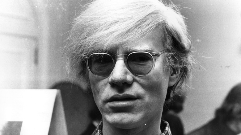 Andy Warhol wearing sunglasses 