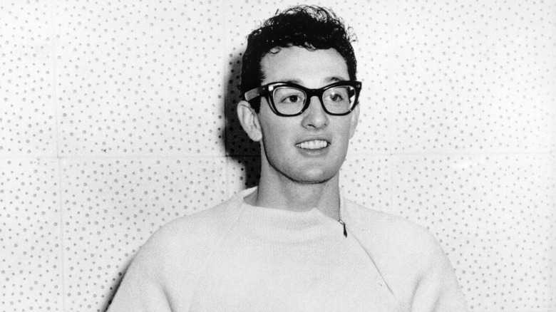 Buddy Holly smiling white sweater
