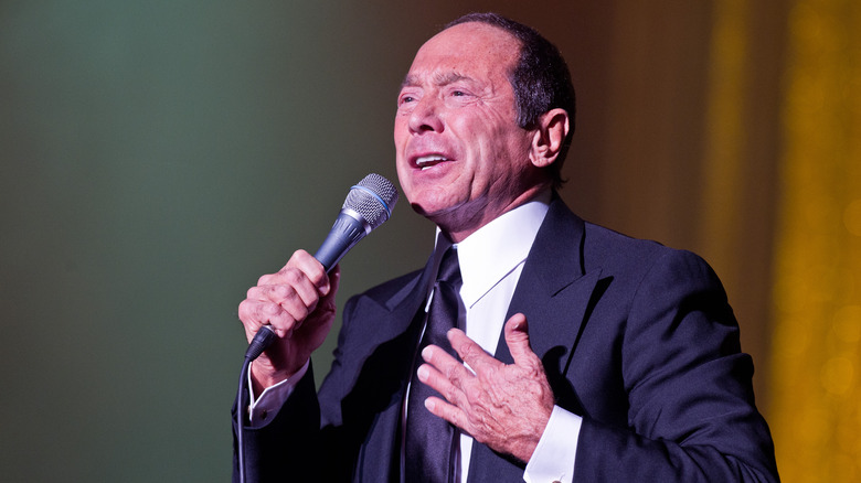 Paul Anka on stage with mic