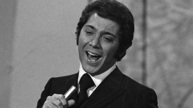 Paul Anka singing in suit