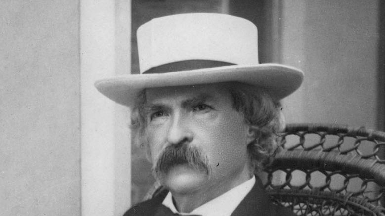 Mark Twain sitting on porch