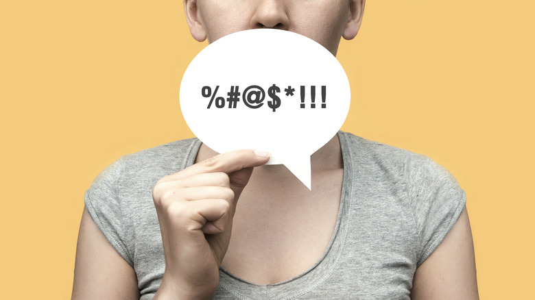 Woman with swear word conversational cloud