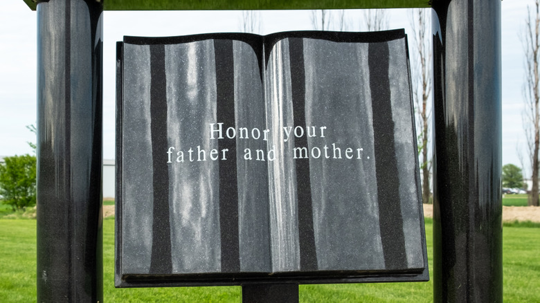 Statue of tablets with honor your father and mother inscribed