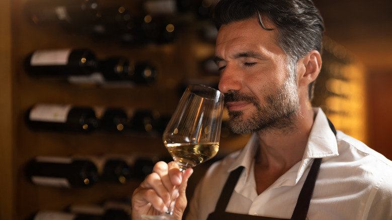 Sommelier tasting bouquet of white wine