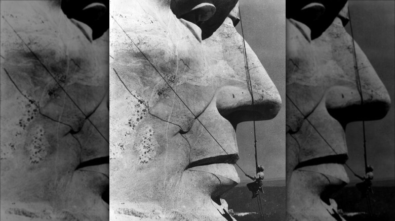 Maintenance technician under Lincoln's nose on mount rushmore