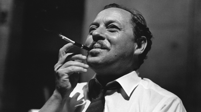 Tennessee Williams with pen in mouth