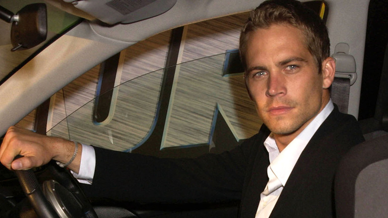 Paul Walker seated in car