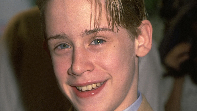 Teenage Macaulay Culkin smiling