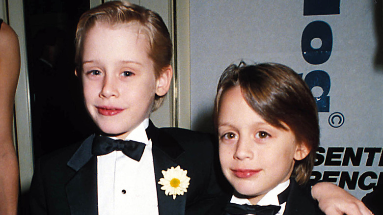 Macaulay and Kieran Culkin as children in suits
