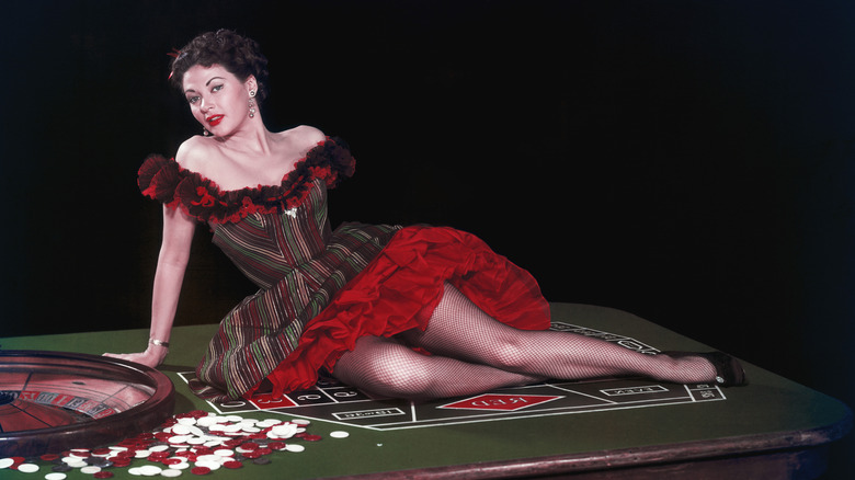 Yvonne De Carlo posing on casino table
