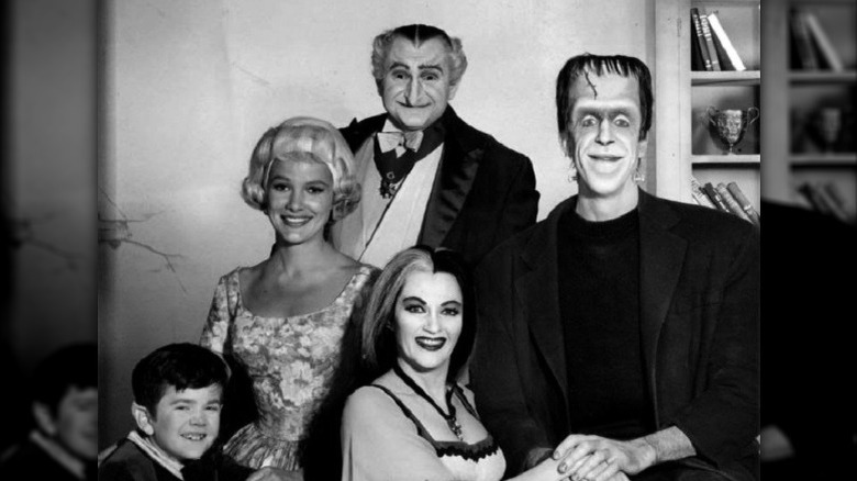 Munsters cast posing