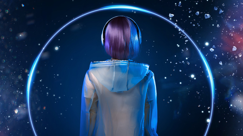 Girl listening to space music on headphones