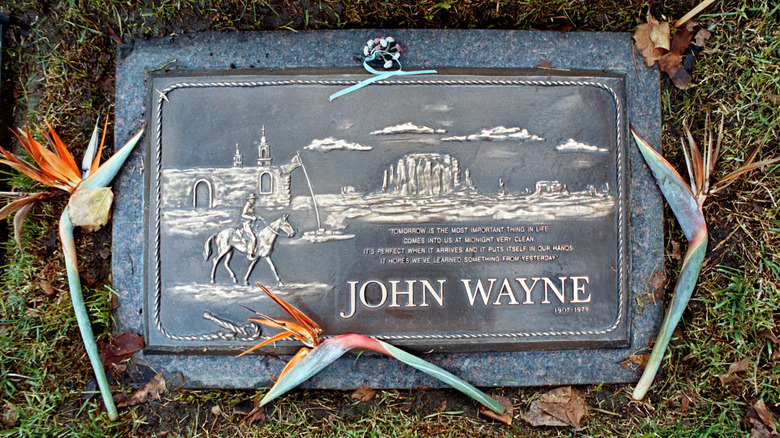John Wayne's headstone with flowers