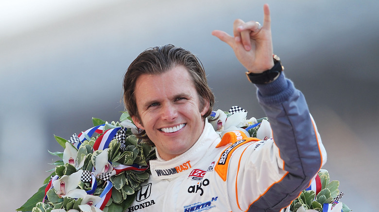 Dan Wheldon smiling with wreath