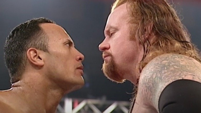 Rock and Undertaker facing off