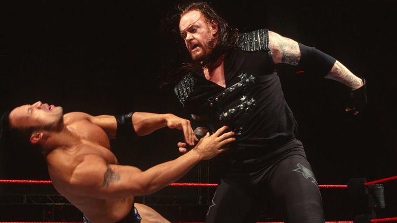 Undertaker attacks The Rock