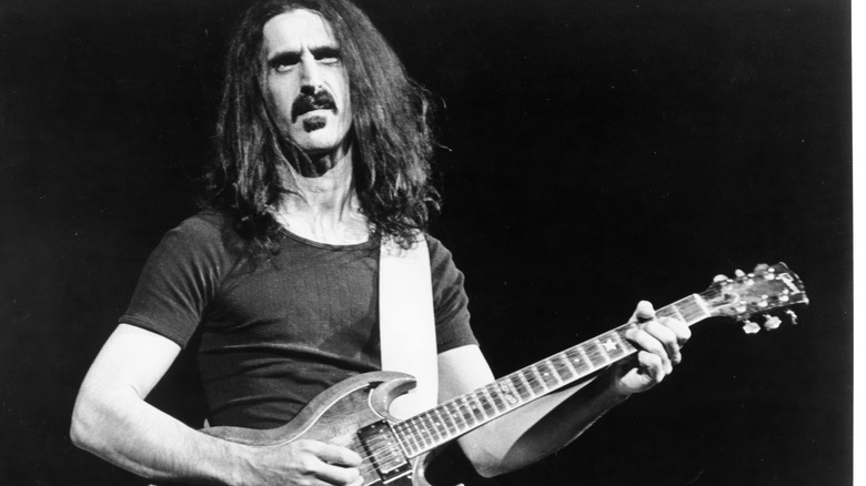Frank Zappa plays guitar