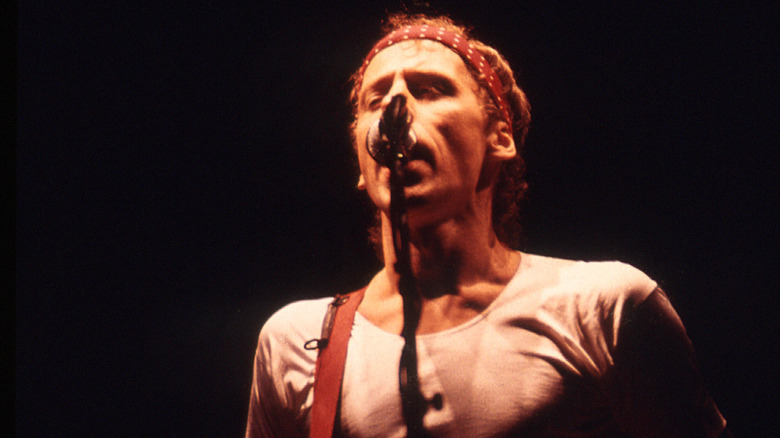 Mark Knopfler performing on stage