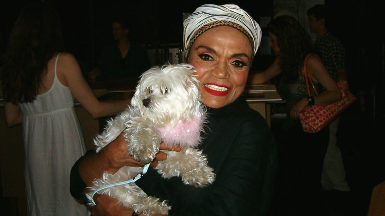 Eartha Kitt at an adoption event with a dog