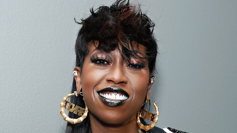 Missy Elliott smiling in black lipstick