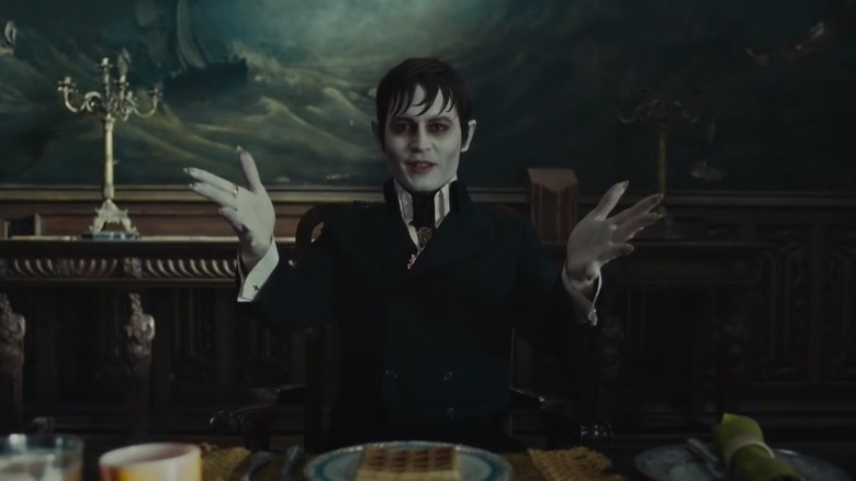 Johnny Depp as Barnabas Collins with hands raised