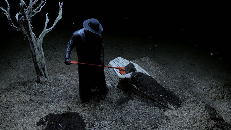 Undertaker burying Xavier Woods
