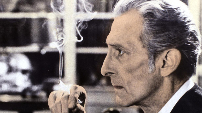 peter cushing smoking a cigarette 