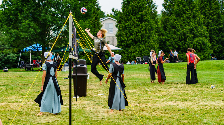  Amish youths play volleyball as part of a tournament at the Intercourse Heritage Days, an annual community festival in Lancaster County.