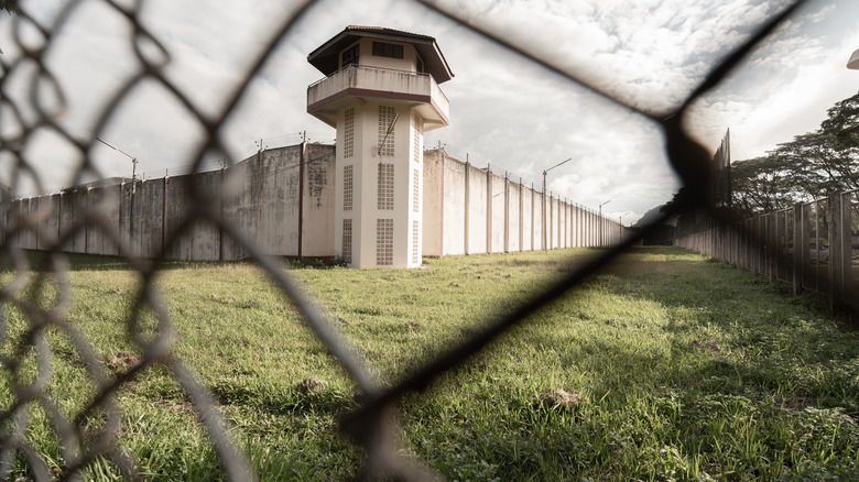 prison seen through a fence