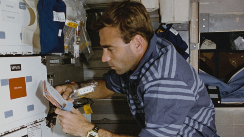Astronaut working in space station