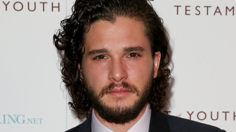 Kit Harington serious in suit