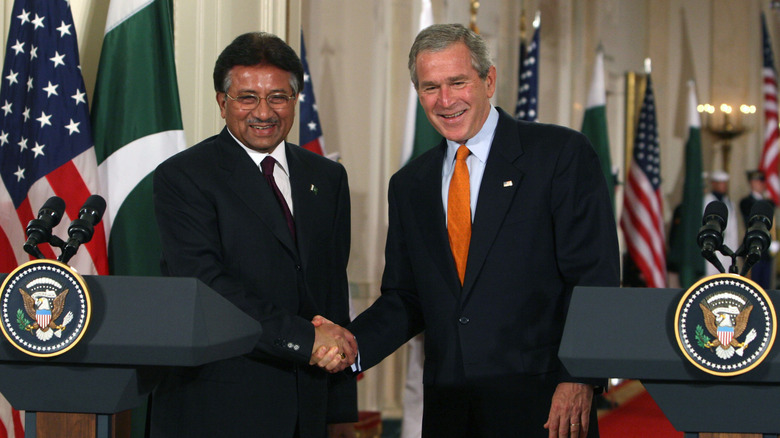 Pervez Musharraf shaking hands George Bush
